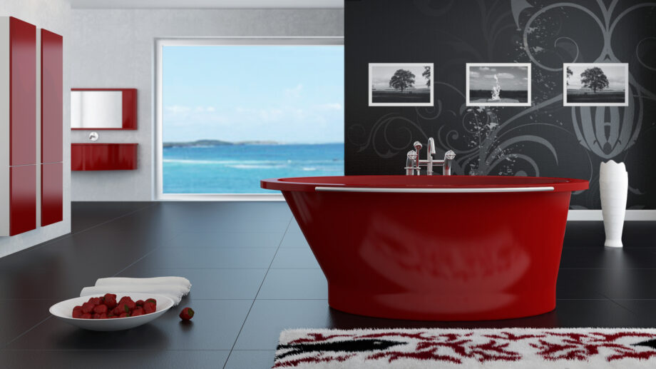 Punast värvi Vispool Solare vann vaatega vannitoas kus on punast värvi vannitoamööbel